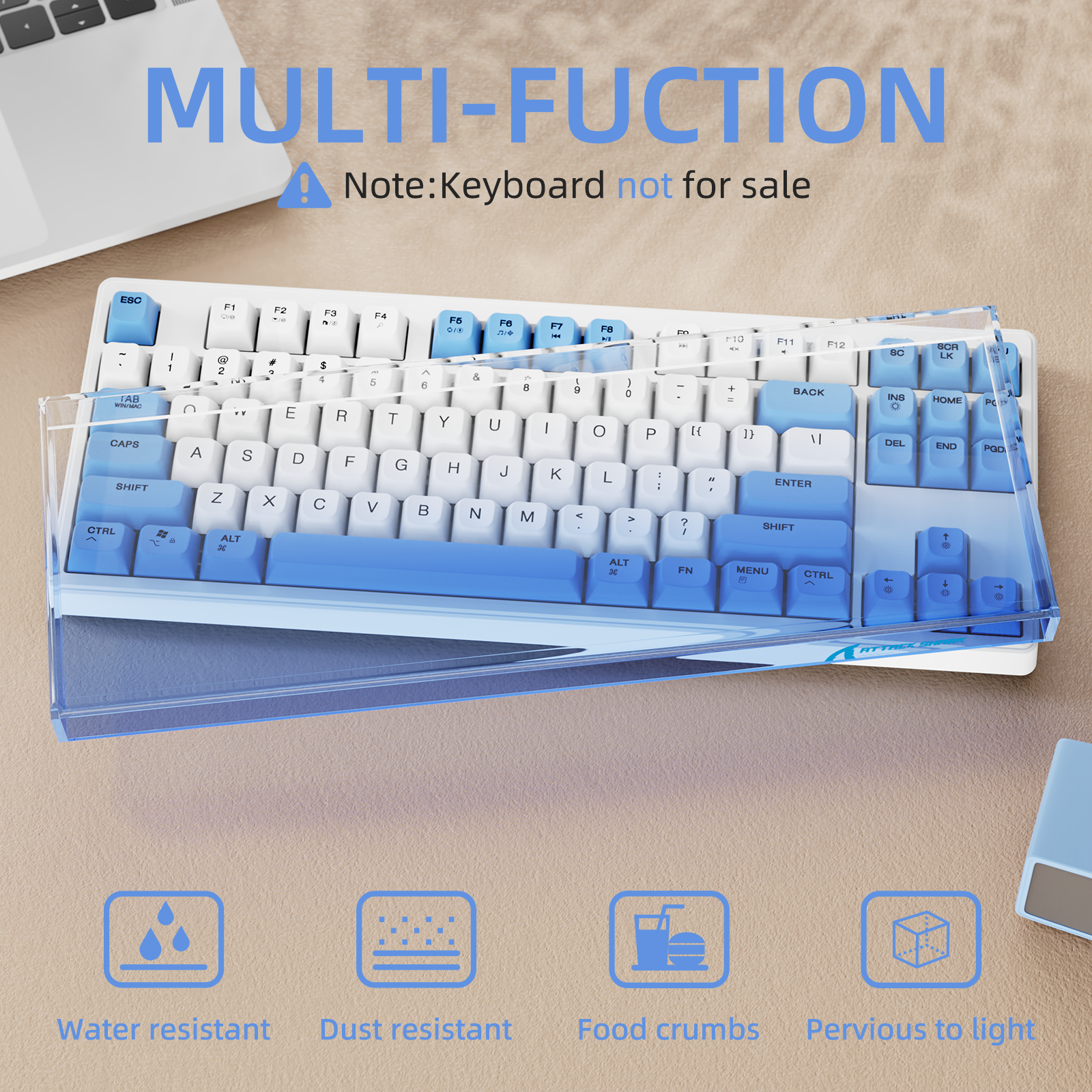 Clear acrylic dust cover protecting an 87-key ATTACK SHARK keyboard with blue and white keys.